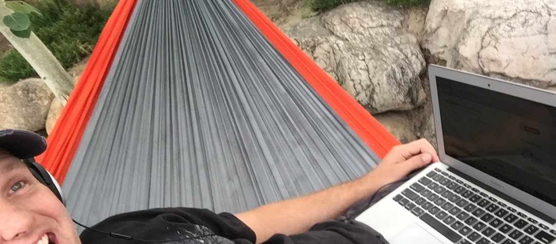 man working inside his hammock
